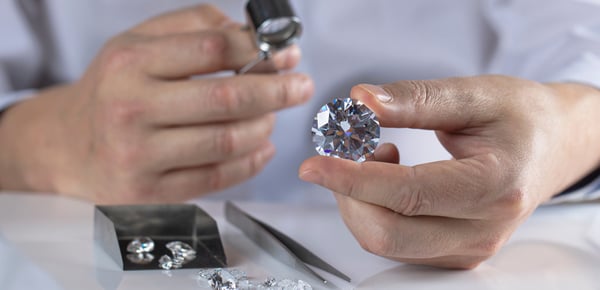 experts inspecting diamond clarity