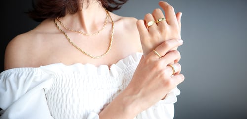 women wearing different rings on hand