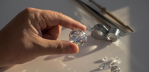 a person holding a diamond